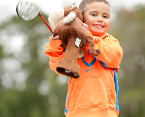 boy-with-golf-headcover