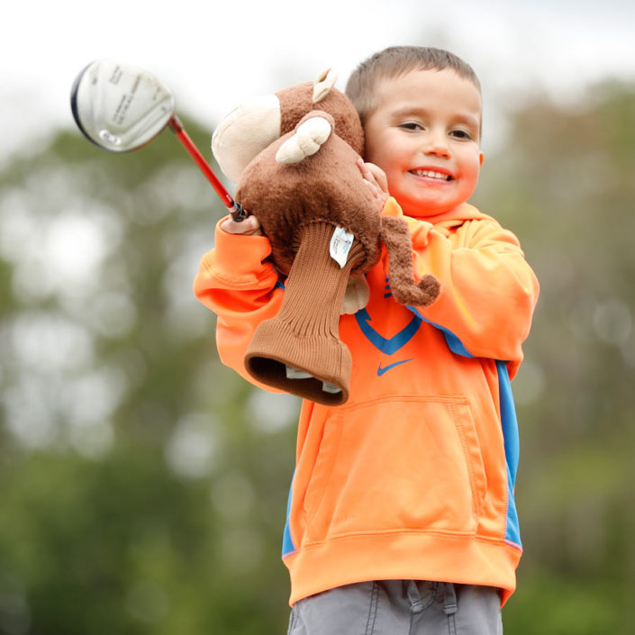 boy-with-golf-headcover