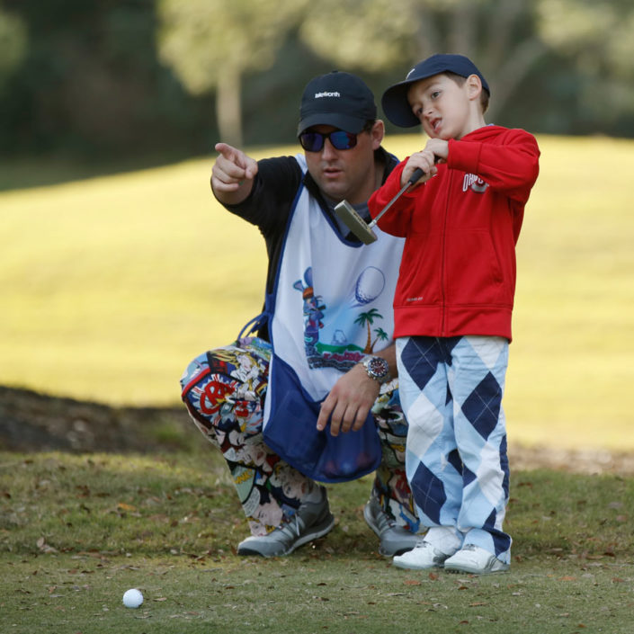 kid-golfer-and-coach